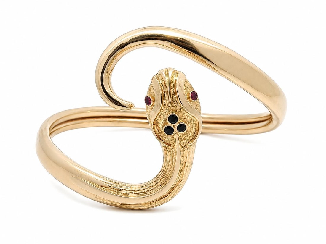 Unbranded 18k Yellow Gold Snake Wrap Bangle with Ruby and Sapphire: Unbranded 18k Yellow Gold Snake Wrap Bangle with Ruby and Sapphire Vintage wrap bangle bracelet in solid 18k yellow gold, designed as a detailed textured and engraved snake serpent motif. It features 