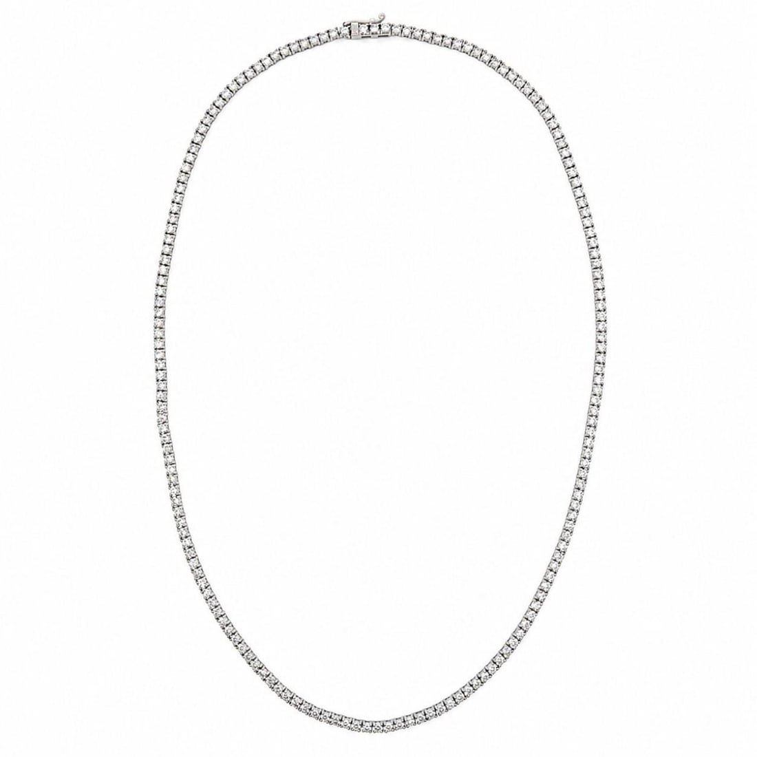 17 Inch 14K White Gold Diamond Tennis Necklace 9.50 Ct: 17 Inch 14K White Gold Diamond Tennis Necklace 9.50 Ct Pre-owned 14K white gold tennis necklace set with 167 diamonds. The diamonds have an approximate total weight of 9.50 ct with stated F-G color an