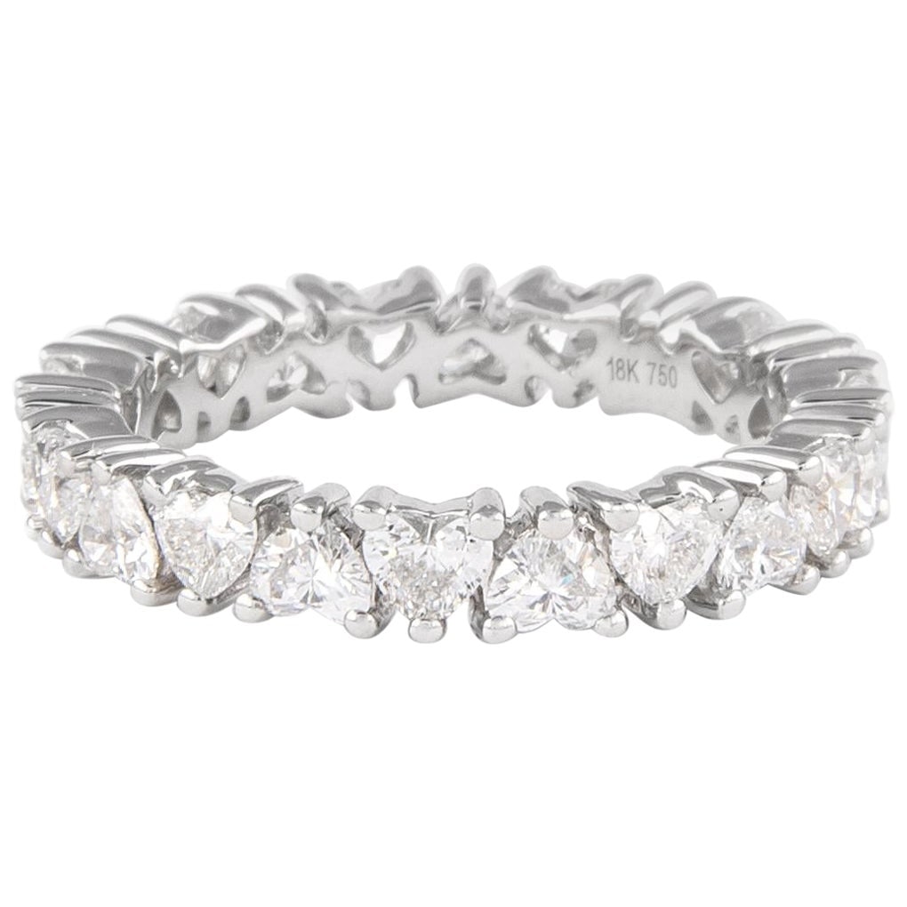 1.92ct Heart Diamond Eternity Band 18k White Gold: 1.92ct Heart Diamond Eternity Band 18k White Gold This exquisite eternity band features a stunning array of 22 heart-shaped diamonds, totaling 1.92 carats. The diamonds boast a beautiful D-F color ran
