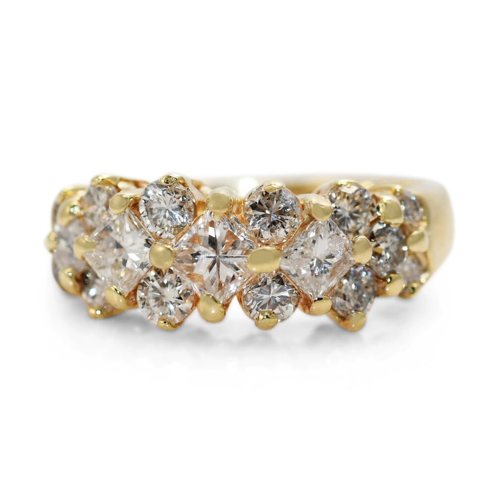 14k Yellow Gold Diamond Cocktail Ring 1.50 tdw 4.8g: 14k Yellow Gold Diamond Cocktail Ring 1.50 tdw 4.8g This ladies' cocktail ring features a 14k yellow gold setting and is adorned with natural diamonds. The design includes three 0.25 carat princess cu