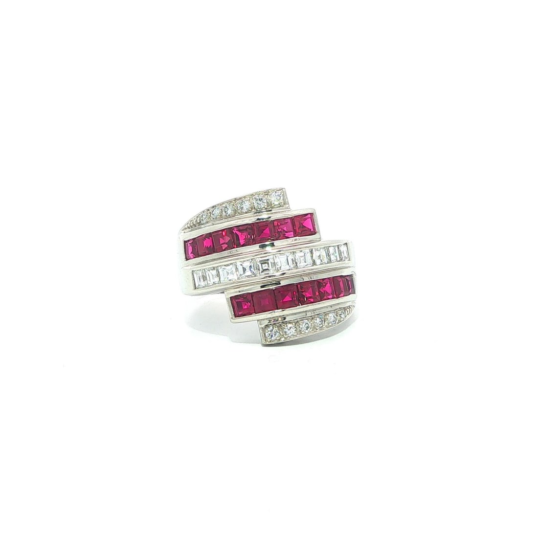 Platinum Ruby Diamond Wide Bypass Cocktail Ring Size 6.5: Platinum Ruby Diamond Wide Bypass Cocktail Ring Size 6.5 This platinum band ring features a striking multi-row bypass design with a stack look, set with natural rubies and diamonds. The ring showcases