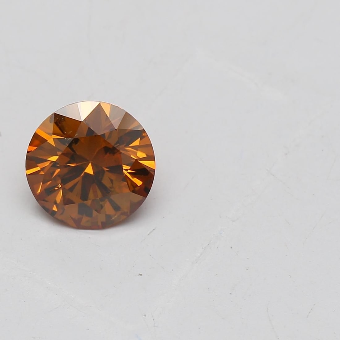 Loose Diamond - ROUND 0.67ct Fancy Deep Brownish Yellowish Orange SI1: Loose Diamond - ROUND 0.67ct Fancy Deep Brownish Yellowish Orange SI1 Source: Natural Shape: ROUND Carats: 0.67 Color: Fancy Deep Brownish Yellowish Orange Certification: GIA Video: