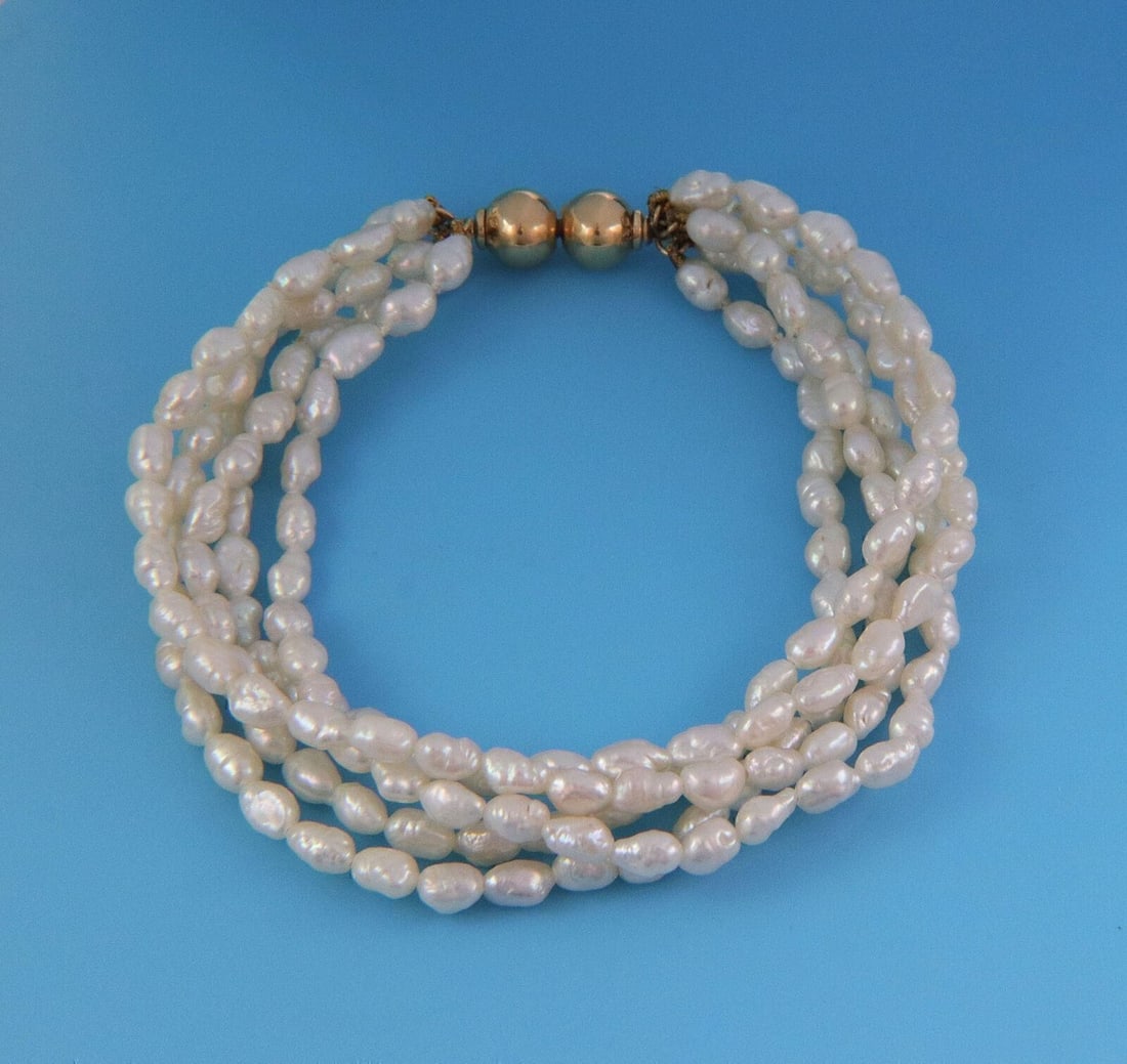 Mikimoto 18k Yellow Gold Multi Strand Freshwater Rice Pearl Bracelet: Mikimoto 18k Yellow Gold Multi Strand Freshwater Rice Pearl Bracelet Authentic Mikimoto multi-strand bracelet featuring five strands of freshwater cultured rice pearls with 18k yellow gold accents. Th