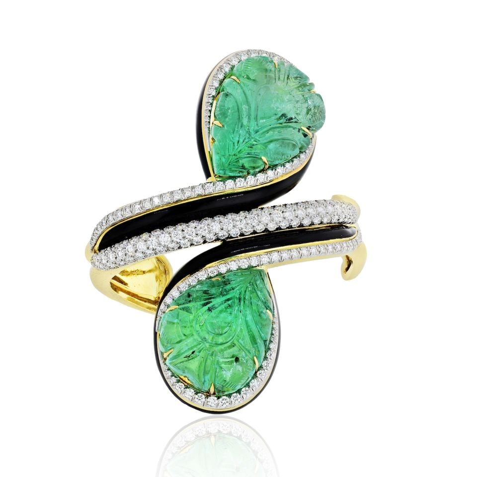David Webb Crossover Bracelet Platinum 18K Gold Emerald Diamond 5.91 Cts: David Webb Crossover Bracelet Platinum 18K Gold Emerald Diamond 5.91 Cts This exquisite David Webb Crossover Bracelet combines the elegance of platinum and 18K yellow gold with stunning carved emerald