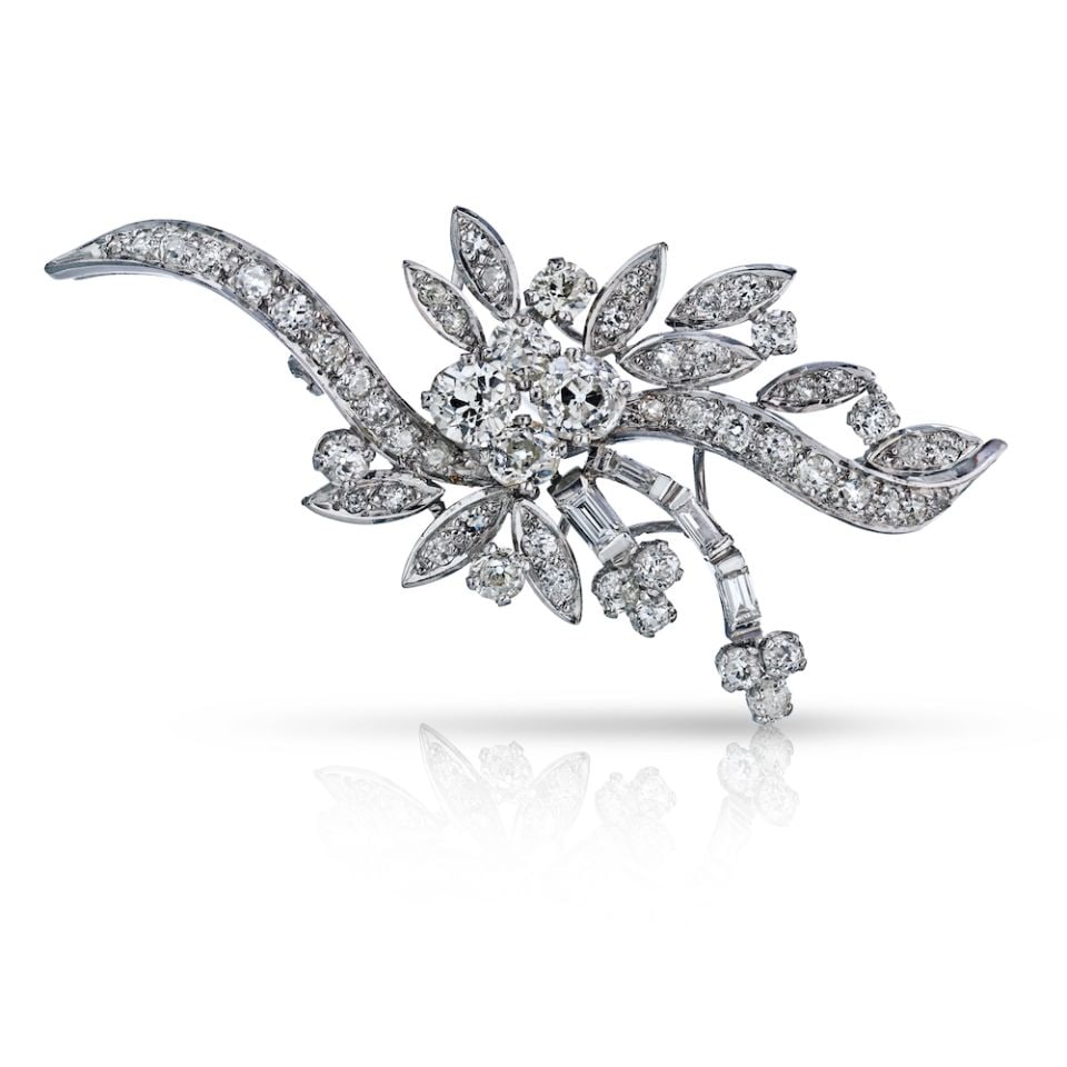 Platinum 7 Carat Old Mine Diamond Brooch with 4 Diamonds: Platinum 7 Carat Old Mine Diamond Brooch with 4 Diamonds This exquisite brooch features a stunning collection of four beautiful old mine cut diamonds, elegantly set in platinum. Weighing approximately