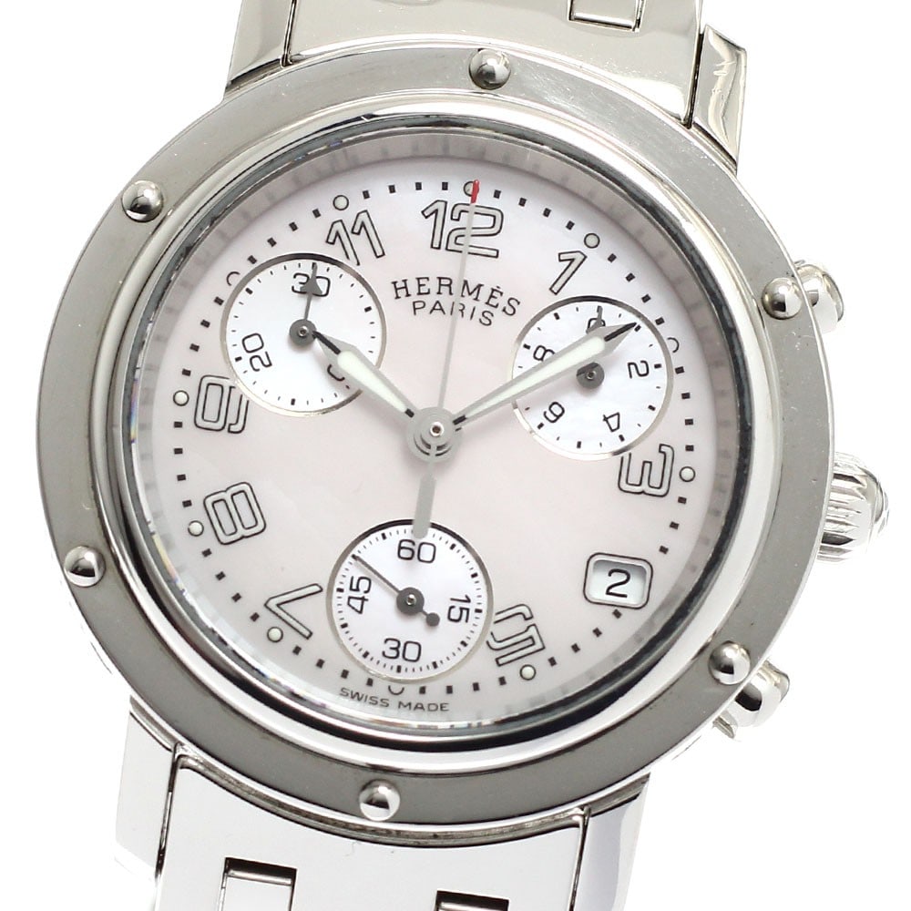 Hermes Clipper Chrono Date Quartz Pink Shell Women's Wristwatch: Hermes Clipper Chrono Date Quartz Pink Shell Women's Wristwatch This pre-owned HERMES Clipper Chrono Date Quartz women's wristwatch features a stainless steel case and bracelet with a pink shell dial.