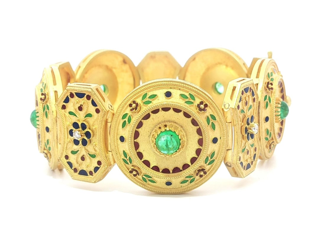 Etruscan Revival 18k Gold Bracelet With Emeralds Diamonds and Enamel Detailing: Etruscan Revival 18k Gold Bracelet With Emeralds Diamonds and Enamel Detailing This substantial Etruscan Revival bracelet is crafted from solid 18k yellow gold, showcasing vibrant blue, red, and green