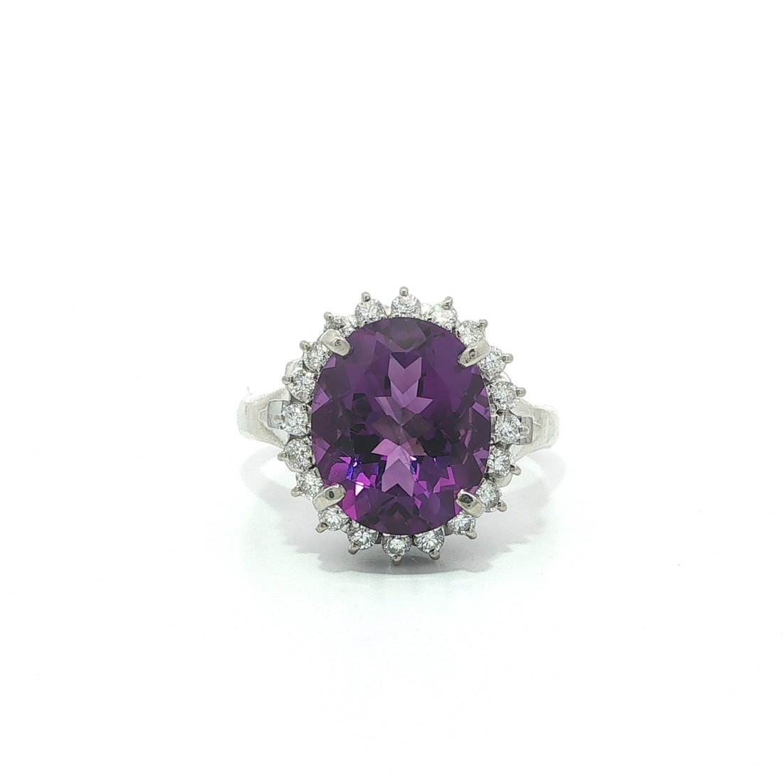 Platinum Cocktail Ring with 4.65ctw Amethyst and Diamond Halo: Platinum Cocktail Ring with 4.65ctw Amethyst and Diamond Halo Vintage cocktail ring featuring a natural oval-cut amethyst in a rich brilliant purple color, framed by a halo of natural round brilliant 