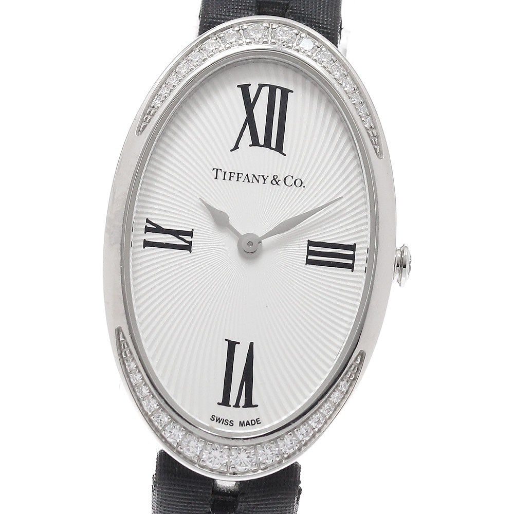 TIFFANY&Co. Cocktail Women's Quartz Wristwatch with Diamond Bezel: TIFFANY&Co. Cocktail Women's Quartz Wristwatch with Diamond Bezel Tiffany & Co. Cocktail Watch is a women's pre-owned quartz wristwatch from Switzerland. It features a stainless steel case, leather/sa
