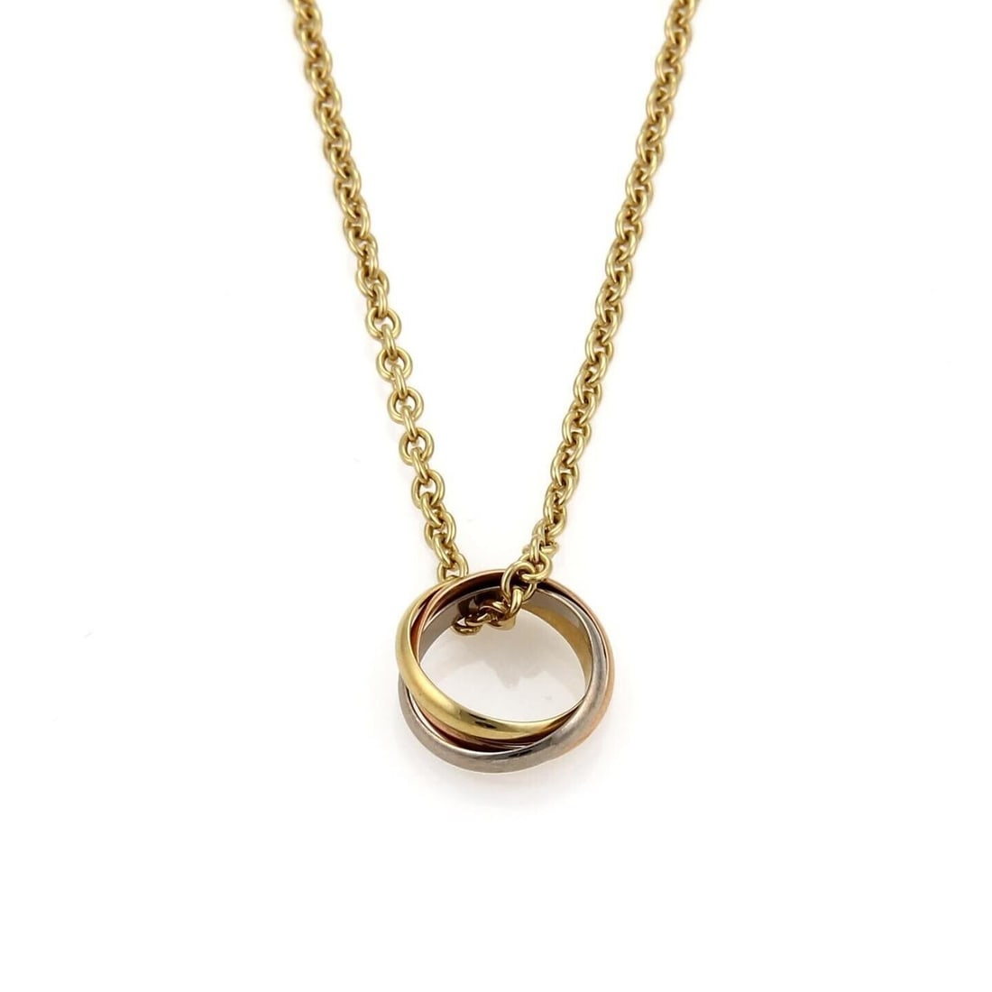 Cartier Trinity Pendant Necklace in 18k Tri Color Gold: Cartier Trinity Pendant Necklace in 18k Tri Color Gold Authentic Cartier Trinity pendant necklace featuring three interlocking rings in 18k rose gold, yellow gold, and white gold. This vintage origina