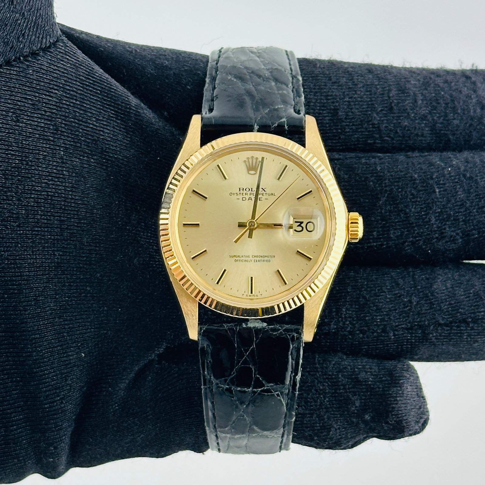 Rolex Oyster Perpetual Date 1503 Champagne Stick Dial Leather Band: Rolex Oyster Perpetual Date 1503 Champagne Stick Dial Leather Band This Rolex Oyster Perpetual Date features a champagne stick dial and a fluted bezel, paired with a generic leather band. The watch is