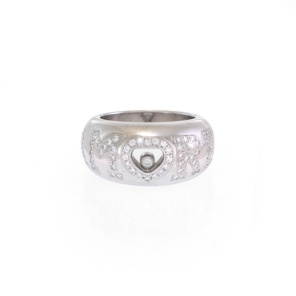 Chopard AMORE Diamond Ring 18k White Gold Heart Design: Chopard AMORE Diamond Ring 18k White Gold Heart Design Introducing the exquisite Chopard AMORE Diamond Ring, part of the iconic Happy Diamond Collection. This stunning dome band ring is expertly craft