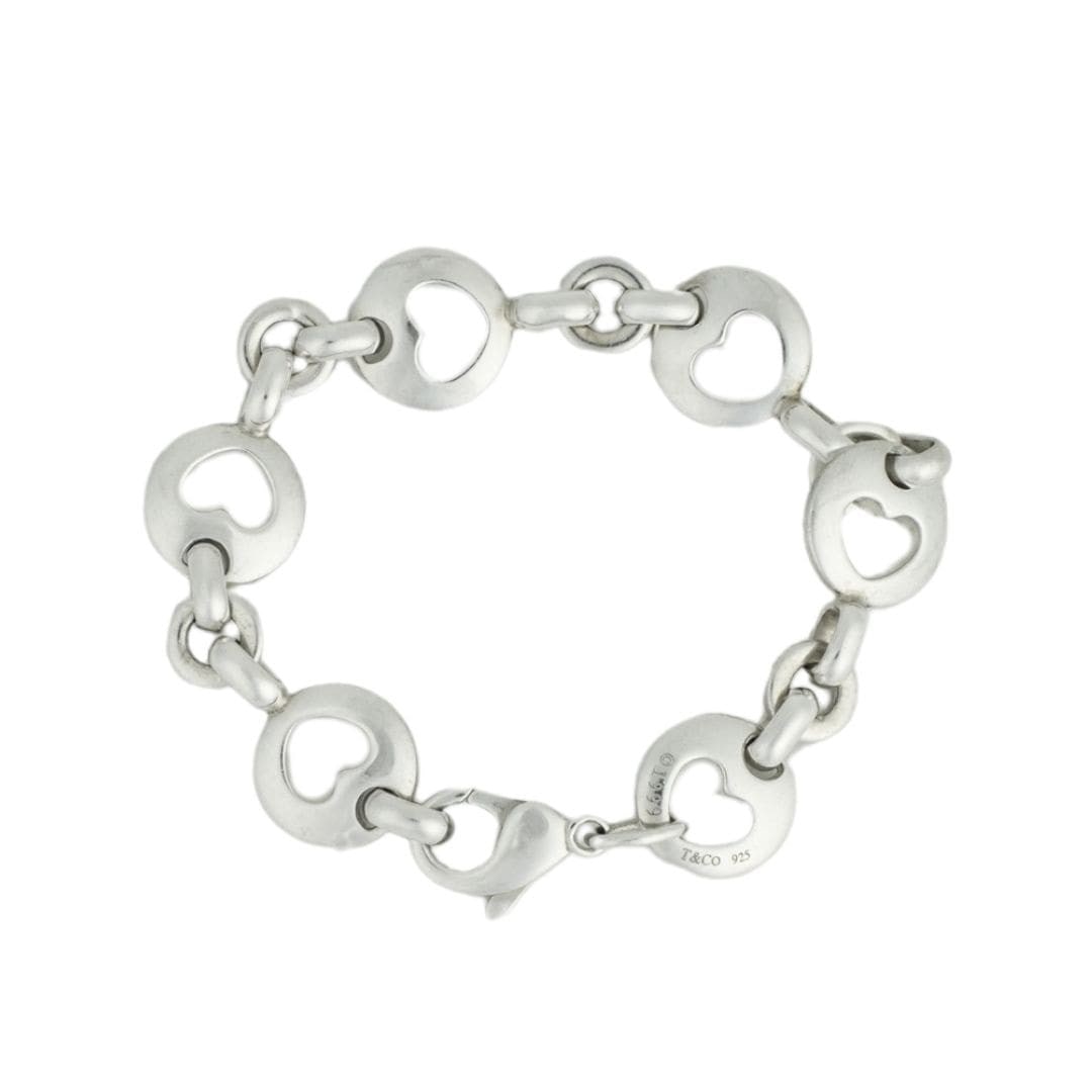 Tiffany & Co. Open Heart Sterling Silver Bracelet with Box Bag: Tiffany & Co. Open Heart Sterling Silver Bracelet with Box Bag Classic Tiffany & Co. open heart link bracelet in sterling silver with a dated 1999 stamp. This pre-owned bracelet features the recogniza