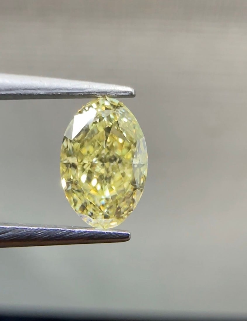 Loose Diamond - OVAL 0.72ct Fancy Yellow VS2: Loose Diamond - OVAL 0.72ct Fancy Yellow VS2 Source: Natural Shape: OVAL Carats: 0.72 Color: Fancy Yellow Certification: GIA The Diamond Depot Guarantee: All items in this auction are guaranteed to be