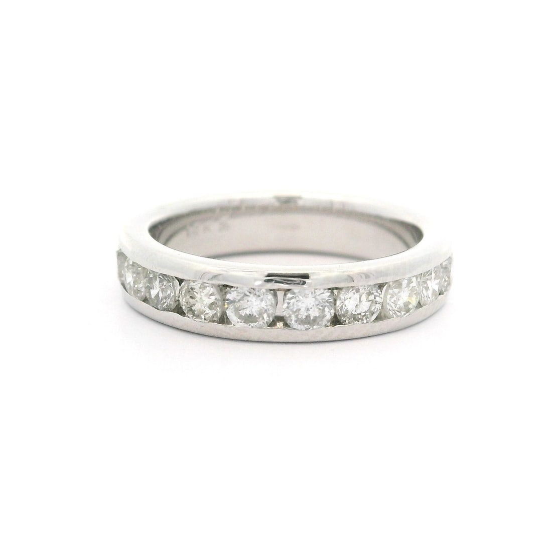 Elegant 14k White Gold 0.90ctw Channel Set Diamond Band Ring: Elegant 14k White Gold 0.90ctw Channel Set Diamond Band Ring This exquisite Classic 14k White Gold Diamond Band Ring is a stunning choice for weddings or anniversaries. The ring features 11 natural, g