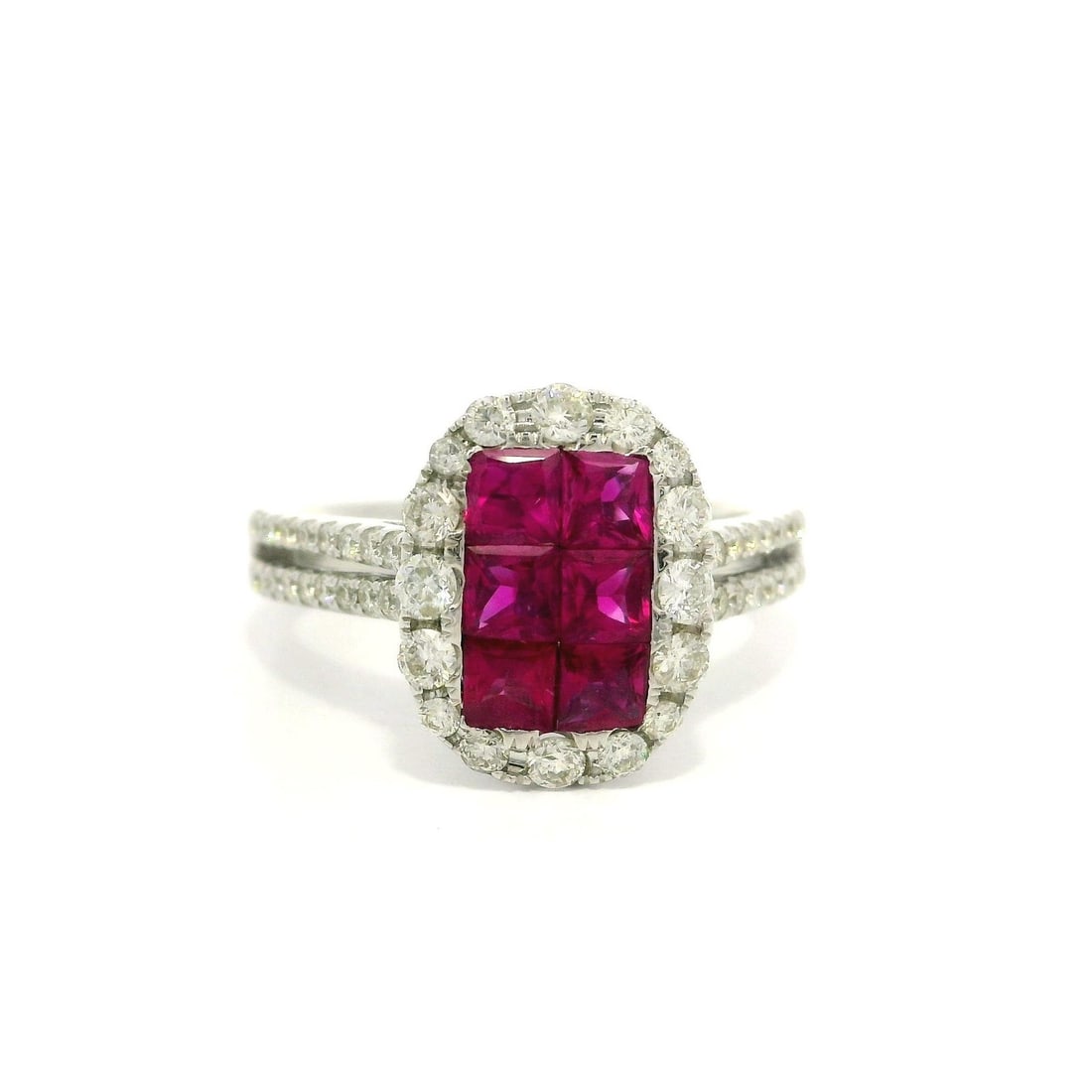 18k White Gold 1.75ctw Ruby Diamond Cocktail Ring: 18k White Gold 1.75ctw Ruby Diamond Cocktail Ring This stunning cocktail ring features an elongated cushion shape design crafted from solid 18k white gold. The centerpiece showcases six natural genuin