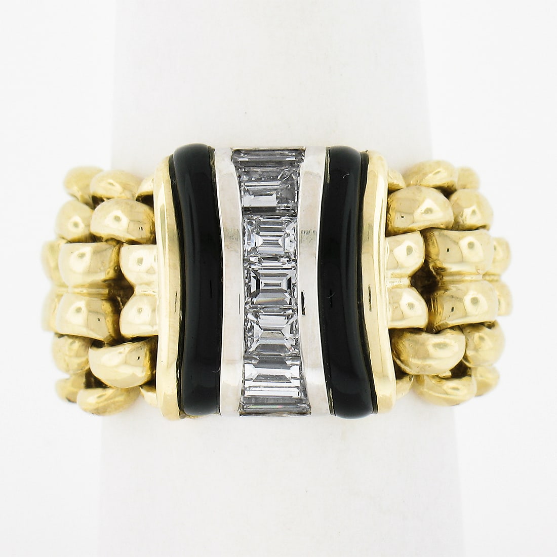 18K Two Tone Gold Black Onyx & 1ctw Diamond Wide Band Ring: 18K Two Tone Gold Black Onyx & 1ctw Diamond Wide Band Ring This stunning 18K Two Tone Gold ring features a striking combination of natural black onyx and exquisite diamonds. The ring is designed as a 