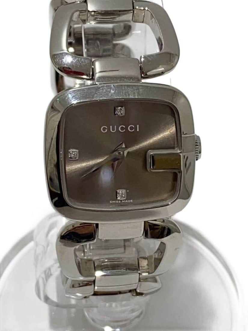 GUCCI 125.5 G-Collection Stainless Steel Quartz Wristwatch for Women: GUCCI 125.5 G-Collection Stainless Steel Quartz Wristwatch for Women Women's Gucci G-Collection quartz wristwatch in silver stainless steel, made in Switzerland. The watch is pre-owned and shows sligh