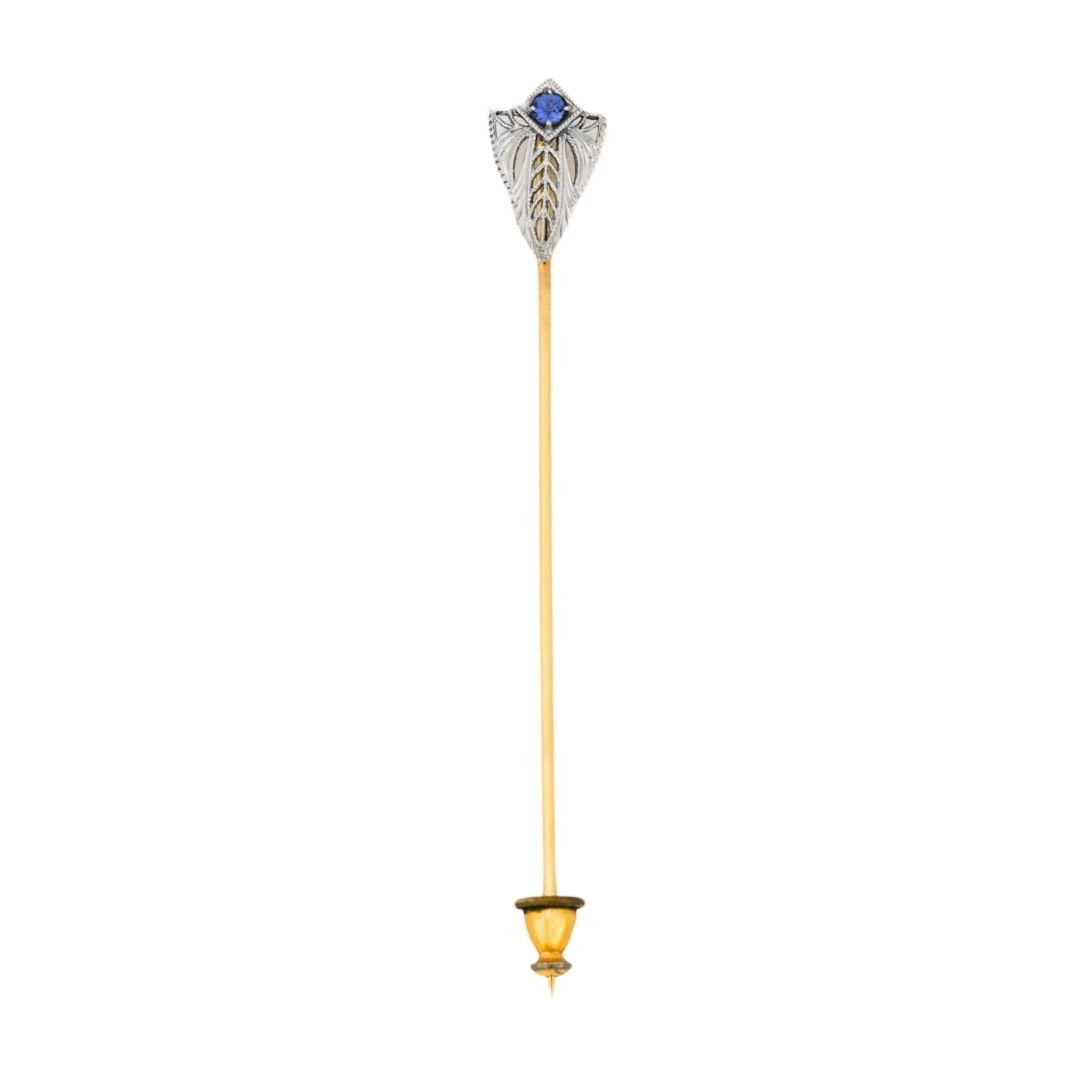 Art Deco 14K Two Tone Gold Spinel Stick Pin: Art Deco 14K Two Tone Gold Spinel Stick Pin This antique stick pin features a triangle-shaped natural blue spinel set in 14K yellow and white gold. Designed in the Art Deco style, it also includes a s