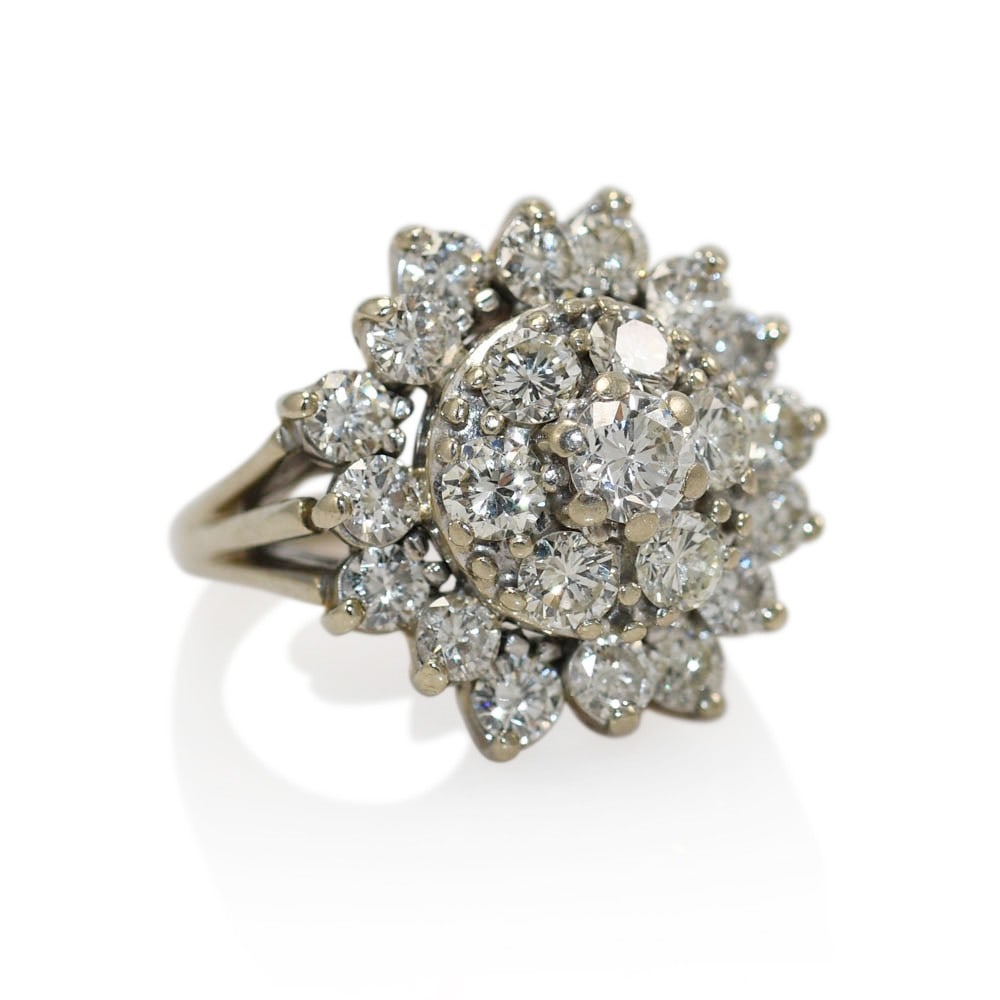 14K White Gold Cluster Diamond Ring Size 6.5 2.30 TDW: 14K White Gold Cluster Diamond Ring Size 6.5 2.30 TDW This 14K white gold diamond cluster ring features a total diamond weight of 2.30 carats. The design includes a center diamond of 0.30 carats, with