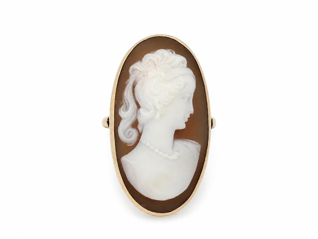 Unbranded Shell Cameo Cocktail Ring in 10-12k Yellow Gold: Unbranded Shell Cameo Cocktail Ring in 10-12k Yellow Gold Vintage handmade cocktail ring featuring an elongated carved shell cameo with a lady portrait. The cameo is bezel set in solid yellow gold, an