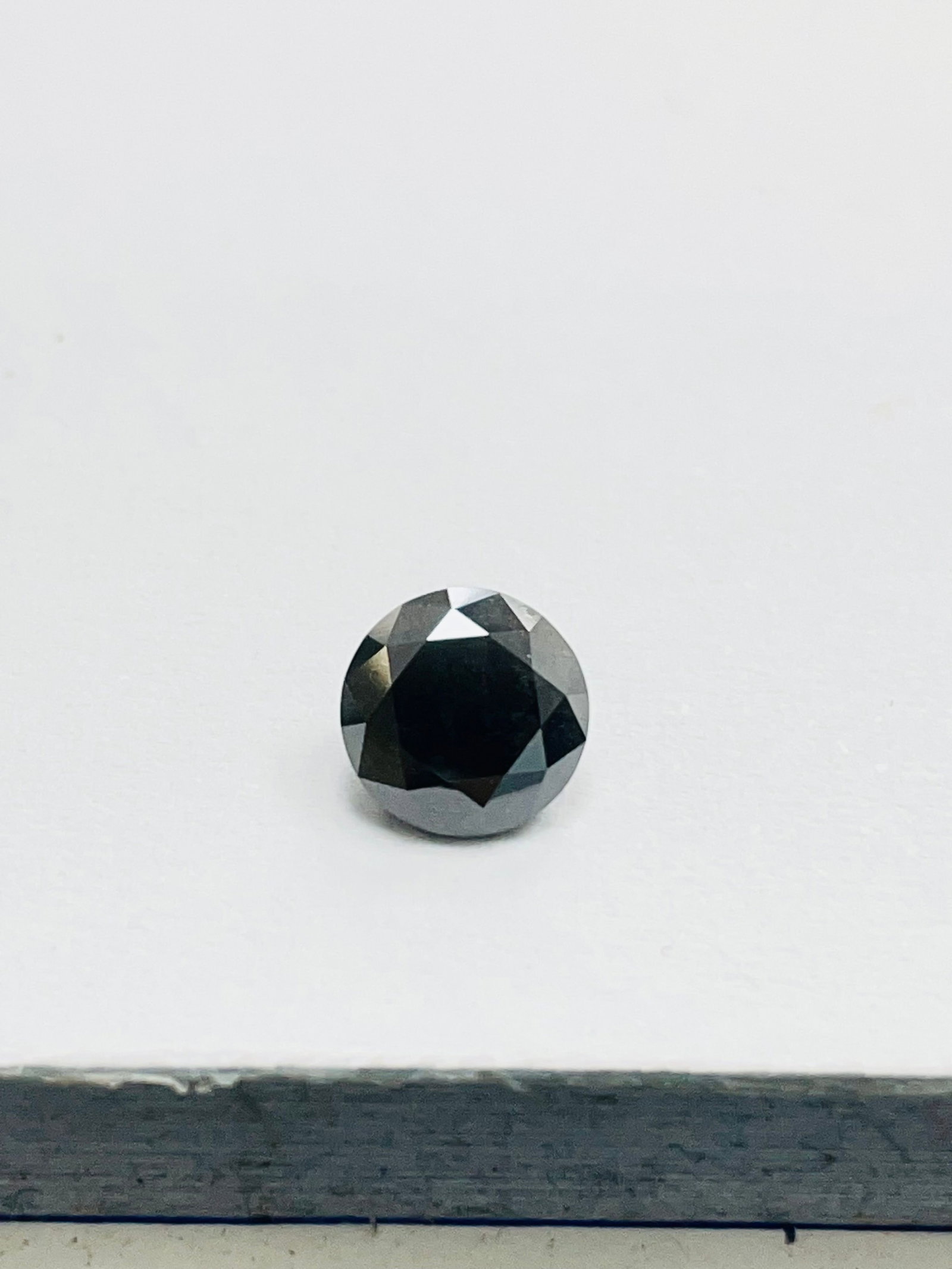 Loose Diamond - ROUND 1.23ct Fancy Black: Loose Diamond - ROUND 1.23ct Fancy Black Source: Natural Shape: ROUND Carats: 1.23 Color: Fancy Black Certification: GIA The Diamond Depot Guarantee: All items in this auction are guaranteed to be 100
