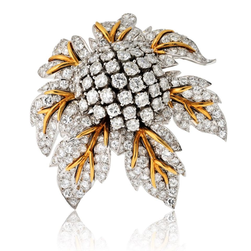 1970s Platinum 18K Yellow Gold 25 Carat Diamond Flower Brooch: 1970s Platinum 18K Yellow Gold 25 Carat Diamond Flower Brooch This exquisite 1970s diamond flower brooch is a testament to vintage luxury, expertly crafted in a stunning combination of platinum and 18