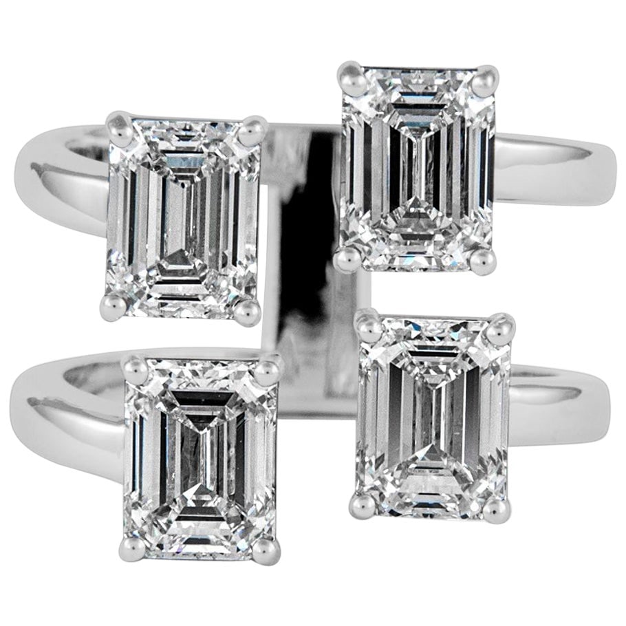 4.02ct GIA Emerald Cut Diamond Ring in 18k White Gold: 4.02ct GIA Emerald Cut Diamond Ring in 18k White Gold This exquisite floating emerald cut diamond ring features a stunning total weight of 4.02 carats, showcasing four high-quality emerald cut diamond