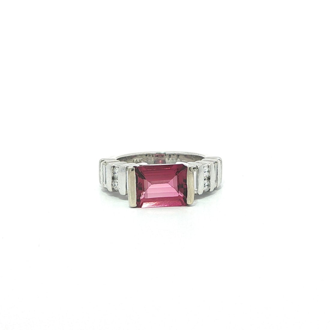 Unbranded Cocktail Ring 14k White Gold Pink Tourmaline and Diamond 3.1ctw: Unbranded Cocktail Ring 14k White Gold Pink Tourmaline and Diamond 3.1ctw Elegant cocktail ring featuring a natural emerald cut pink tourmaline accented by channel-set diamonds in solid 14k white gold