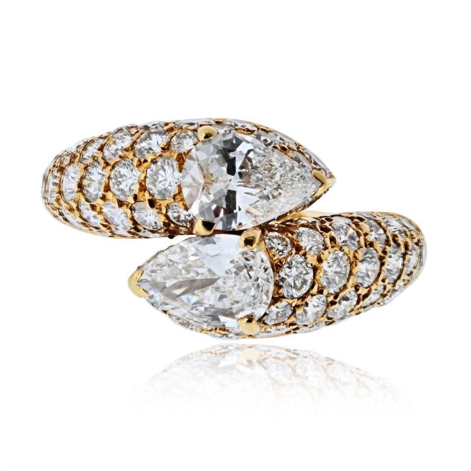18K Yellow Gold Cartier Deux Tetes Croisees Diamond Estate Ring Size 6.25: 18K Yellow Gold Cartier Deux Tetes Croisees Diamond Estate Ring Size 6.25 This estate Cartier Deux Tetes Croisees ring is crafted from 18K yellow gold and showcases a unique bypass design. The ring fe