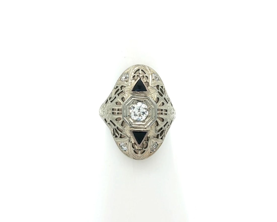 Antique Art Deco 18k White Gold Diamond Floral Cocktail Ring: Antique Art Deco 18k White Gold Diamond Floral Cocktail Ring This exquisite Antique Art Deco ring features a stunning floral design crafted from solid 18k white gold. The centerpiece is a natural genu