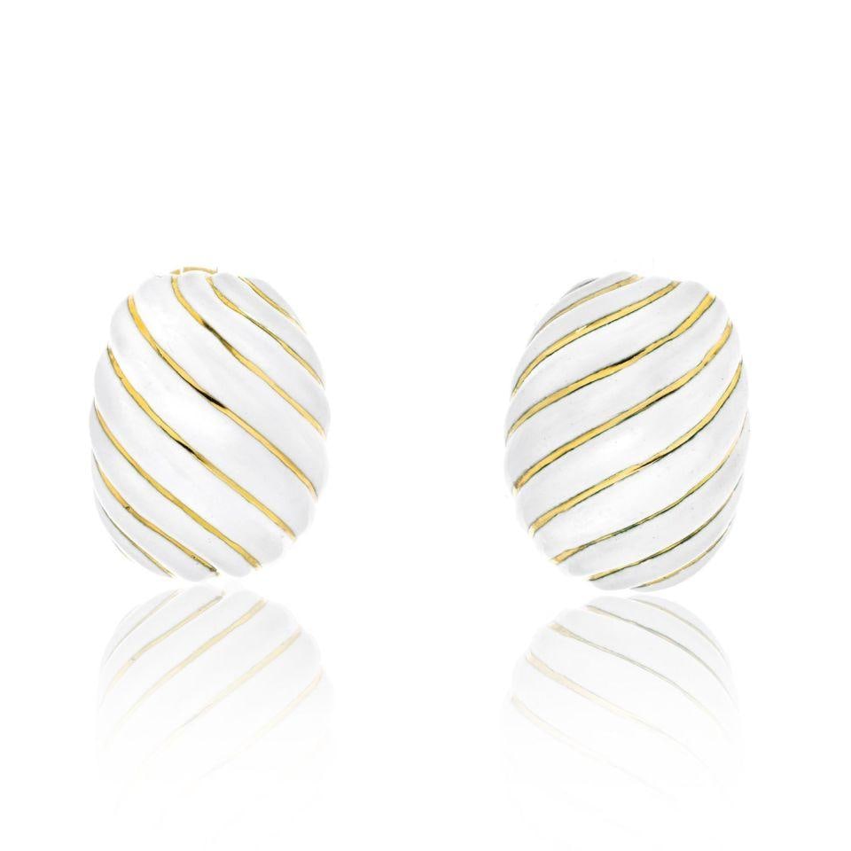 David Webb 1970s Platinum 18K Gold White Enamel Clip Earrings: David Webb 1970s Platinum 18K Gold White Enamel Clip Earrings Introducing a stunning pair of David Webb clip earrings, expertly crafted from a combination of platinum and 18K yellow gold. These earrin