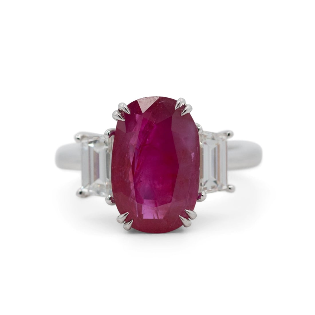 Unbranded Platinum Ring with 6.88ct No Heat Burmese Ruby and Diamonds: Unbranded Platinum Ring with 6.88ct No Heat Burmese Ruby and Diamonds Platinum ring set with a natural Burmese red ruby and diamond accents. The center stone is an oval no-heat ruby, accompanied by tw