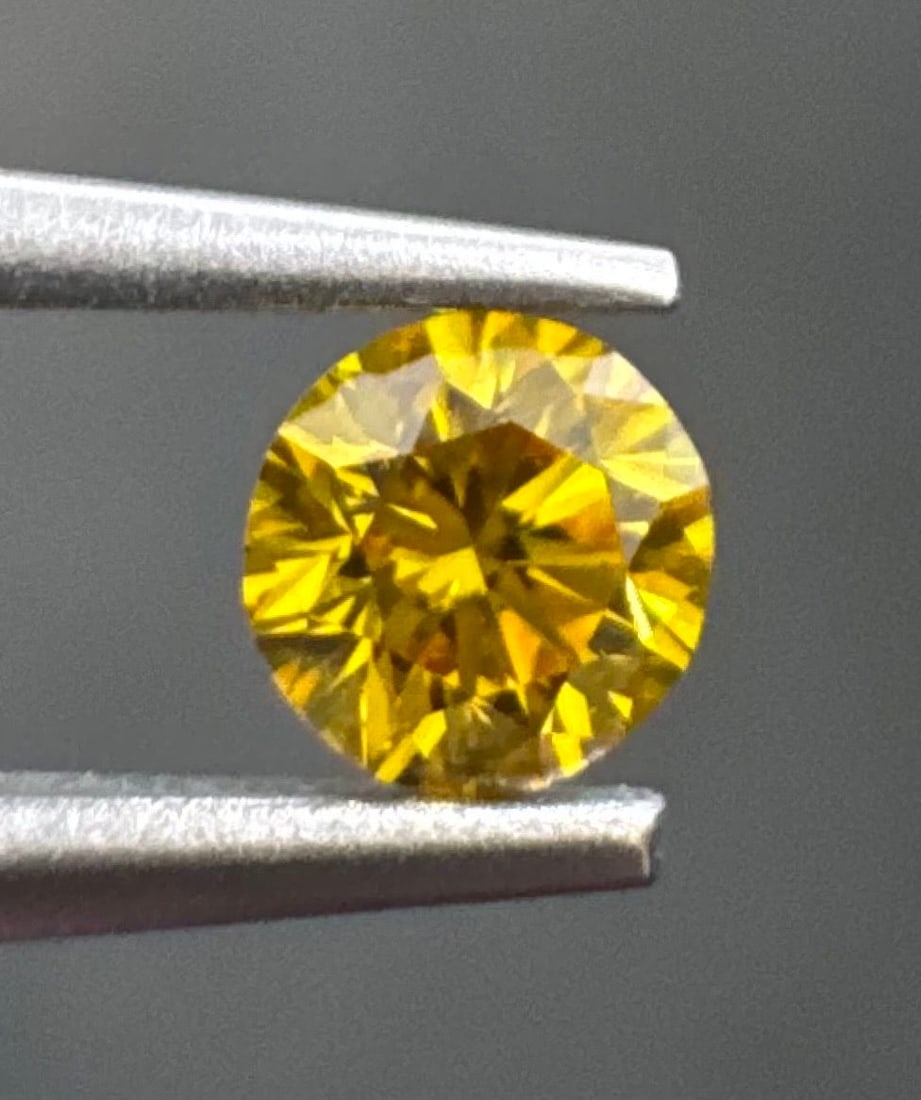Loose Diamond - ROUND 0.2ct Fancy Vivid Orangey Yellow SI2: Loose Diamond - ROUND 0.2ct Fancy Vivid Orangey Yellow SI2 Source: Natural Shape: ROUND Carats: 0.2 Color: Fancy Vivid Orangey Yellow Certification: GIA The Diamond Depot Guarantee: All items in this 