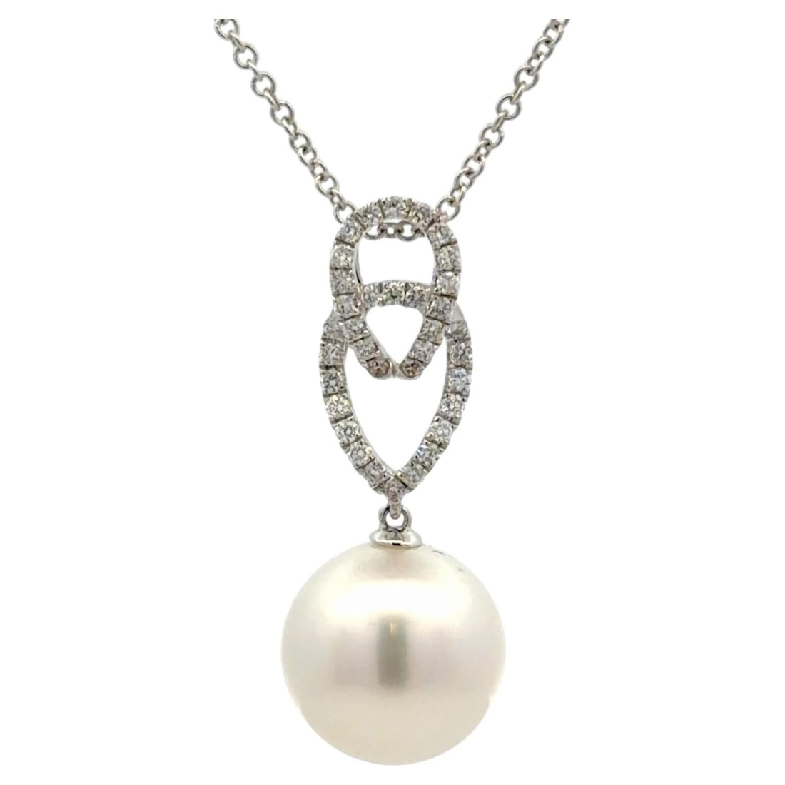 Italian White Gold Pearl Diamond Pendant Necklace 0.25 Cts 12mm: Italian White Gold Pearl Diamond Pendant Necklace 0.25 Cts 12mm This Italian-made pendant necklace is crafted in 18K white gold and showcases a luminous 12mm South Sea pearl suspended from an intricat