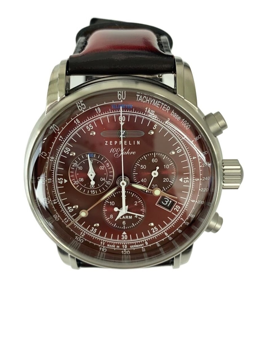 ZEPPELIN men's leather wristwatch 100th Anniversary 8680-5: ZEPPELIN men's leather wristwatch 100th Anniversary 8680-5 This Zeppelin 100th Anniversary 8680-5 men's wristwatch features a red dial and leather band. Made in Germany, the watch is in excellent pre-