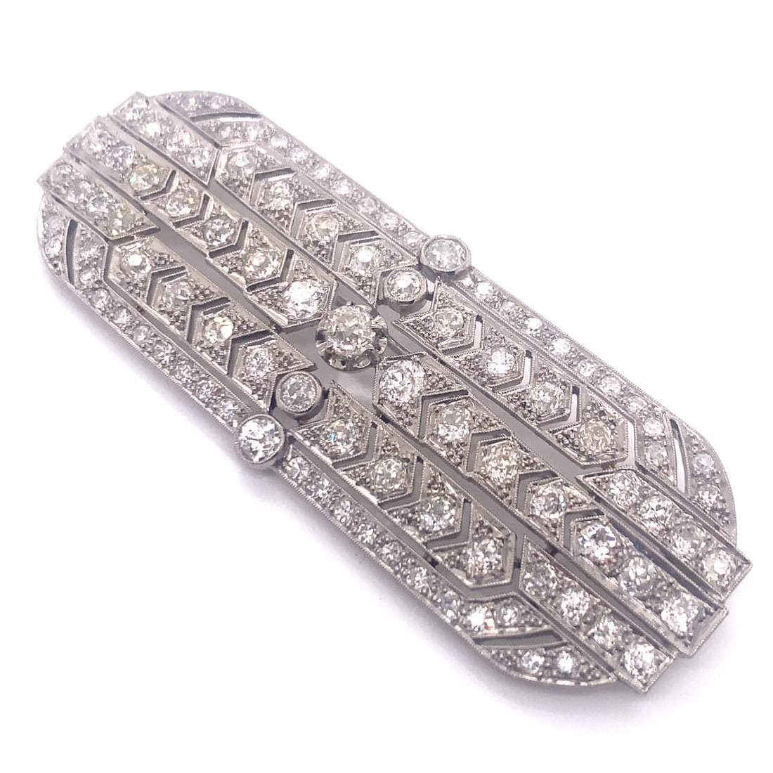 Stunning Art Deco Platinum Brooch with 9.00 Ct European Cut Diamonds: Stunning Art Deco Platinum Brooch with 9.00 Ct European Cut Diamonds This stunning Art Deco Diamond Brooch features approximately 9.00 ct. of exquisite European Cut Diamonds, displaying a color grade 