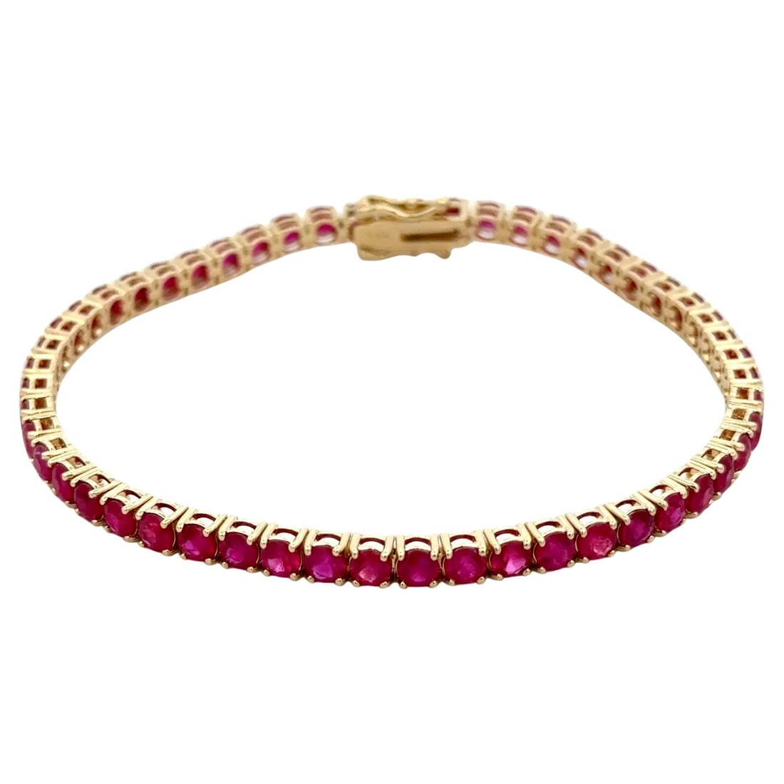 14K Yellow Gold Tennis Bracelet with 8.84 Carat Natural Rubies: 14K Yellow Gold Tennis Bracelet with 8.84 Carat Natural Rubies This elegant tennis bracelet features 52 vibrant natural rubies with a total carat weight of 8.84 carats, set in 14K yellow gold. The bra
