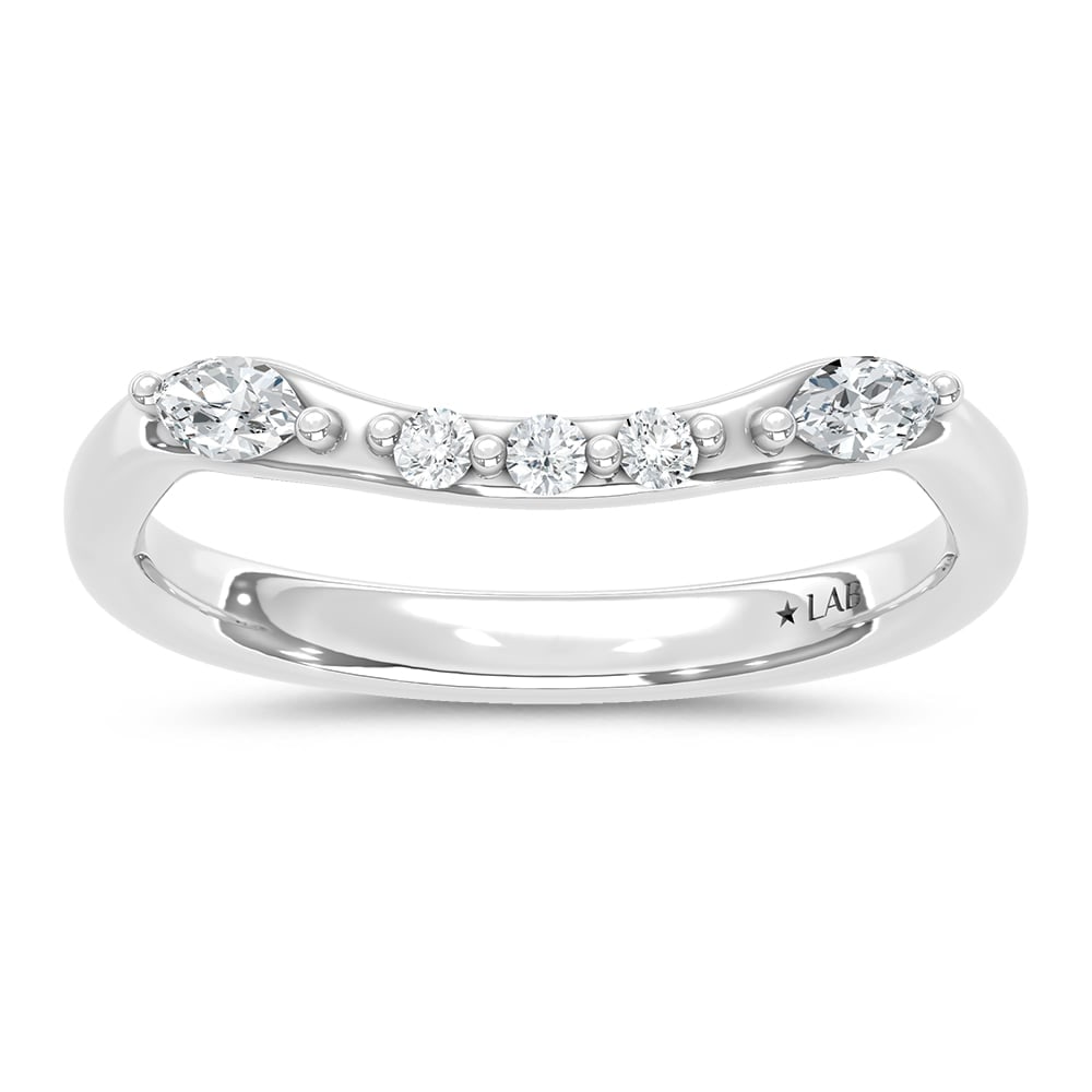 14K White Gold Lab Grown Diamond 1/4 Ct.T. Wedding Band: 14K White Gold Lab Grown Diamond 1/4 Ct.T. Wedding Band Indulge in timeless elegance with our exquisite 14K White Gold Wedding Band, adorned with a meticulously crafted lab-grown diamond. The brillian