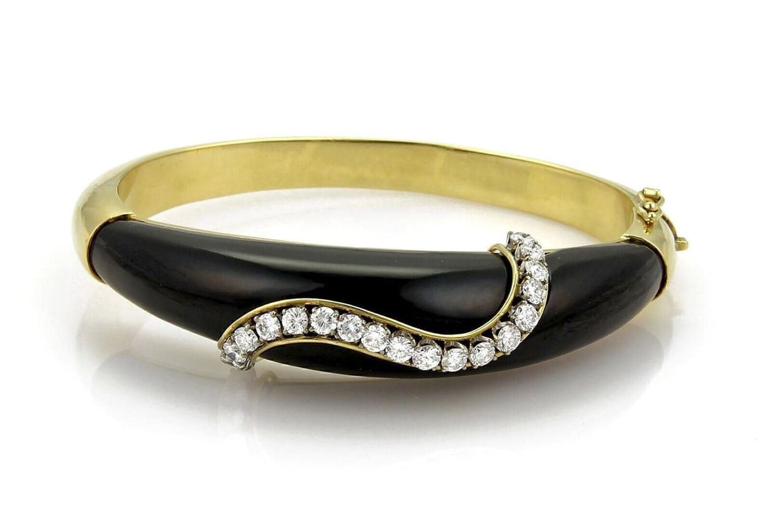 Unbranded 18k Yellow Gold Wide Bangle Bracelet with Black Onyx and Diamonds: Unbranded 18k Yellow Gold Wide Bangle Bracelet with Black Onyx and Diamonds Vintage estate wide bangle bracelet crafted in solid 18k yellow gold, featuring natural black onyx panels and natural diamon