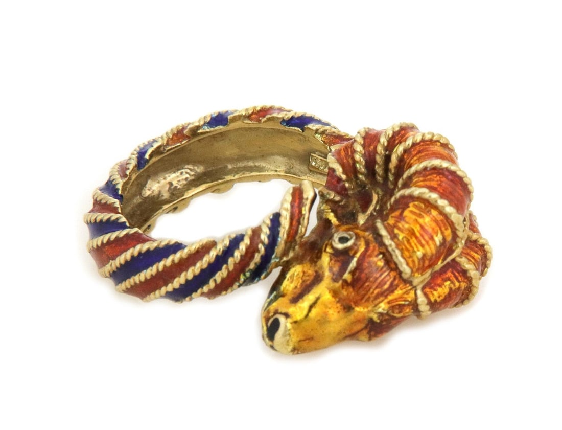 Herakleios 18k Yellow Gold Enamel Ram Head Bypass Ring: Herakleios 18k Yellow Gold Enamel Ram Head Bypass Ring This exquisite Herakleios Ram Head Bypass Ring is a stunning piece crafted from 18k yellow gold. The ring showcases intricately designed curled h