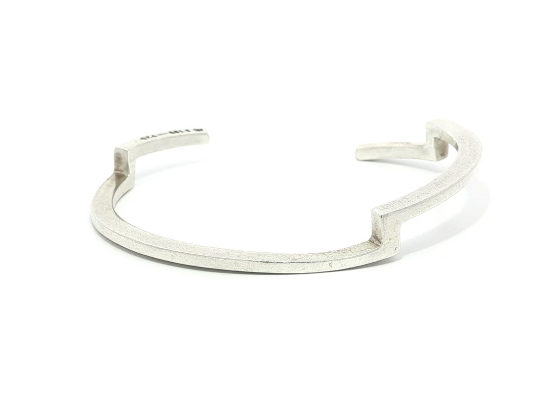 Sterling Silver Geometric Open Cuff Bangle Bracelet: Sterling Silver Geometric Open Cuff Bangle Bracelet This vintage handmade geometric open cuff bangle bracelet is crafted from sterling silver and features a sleek, modern design. Made in Mexico, it is