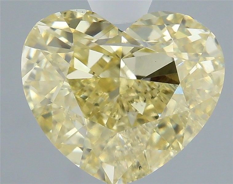 Loose Diamond - HEART 3.03ct Fancy Yellow VS2: Loose Diamond - HEART 3.03ct Fancy Yellow VS2 Source: This is a real non-mined Diamond that has been grown in a lab Shape: HEART Carats: 3.03 Color: Fancy Yellow Certification: IGI Video: