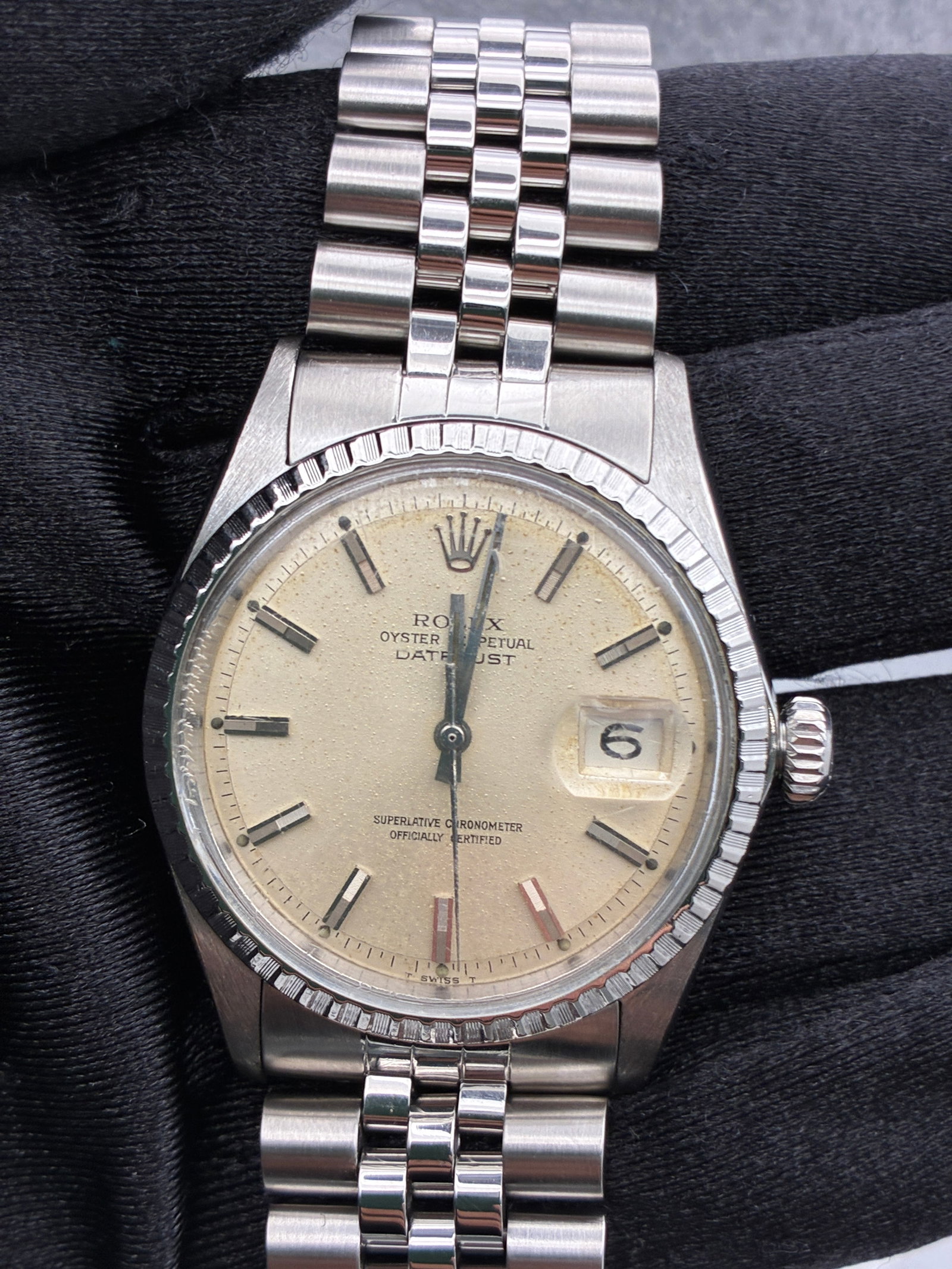 Rolex Datejust 1603 Silver Stick Dial Jubilee Bracelet: Rolex Datejust 1603 Silver Stick Dial Jubilee Bracelet This is a men's Rolex Datejust watch, reference number 1603. It features a silver stick dial with visible spots, an engine-turned bezel, and is f