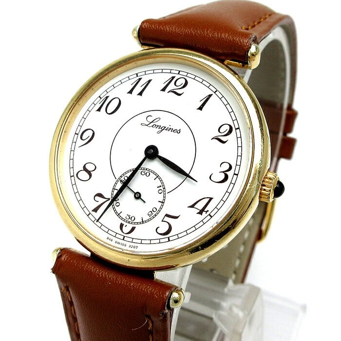 Longines round gold hand wound men's watch Arabic dial small seconds: Longines round gold hand wound men's watch Arabic dial small seconds This vintage Longines men's wristwatch features a round gold-plated case with a white dial and Arabic numeral indices, providing a 