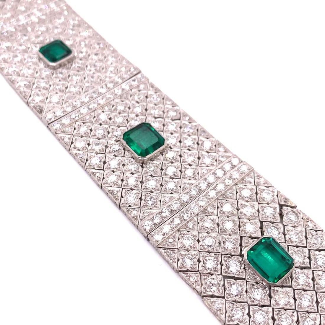 Platinum Art Deco Bracelet with 28.60 Ct Diamonds and Chatham Emeralds: Platinum Art Deco Bracelet with 28.60 Ct Diamonds and Chatham Emeralds This Art Deco bracelet features approximately 400 diamonds with a total weight of 26.80 carats, graded E-G color and VVS-VS clari