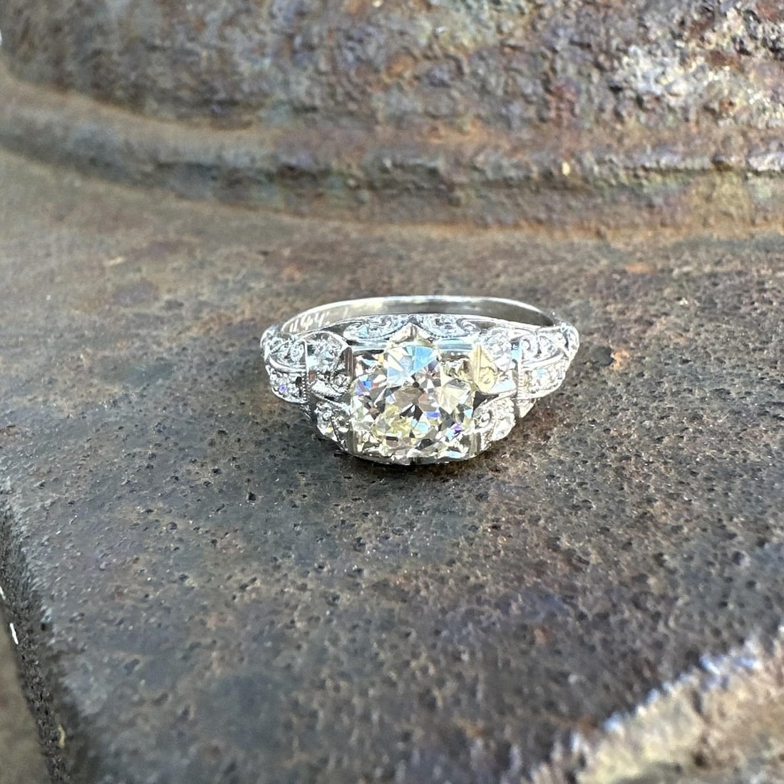 Edwardian Platinum Engagement Ring With GIA Certified Old European Diamond: Edwardian Platinum Engagement Ring With GIA Certified Old European Diamond This antique Edwardian engagement ring features a buckle-style design crafted in solid platinum. At its center is a natural o