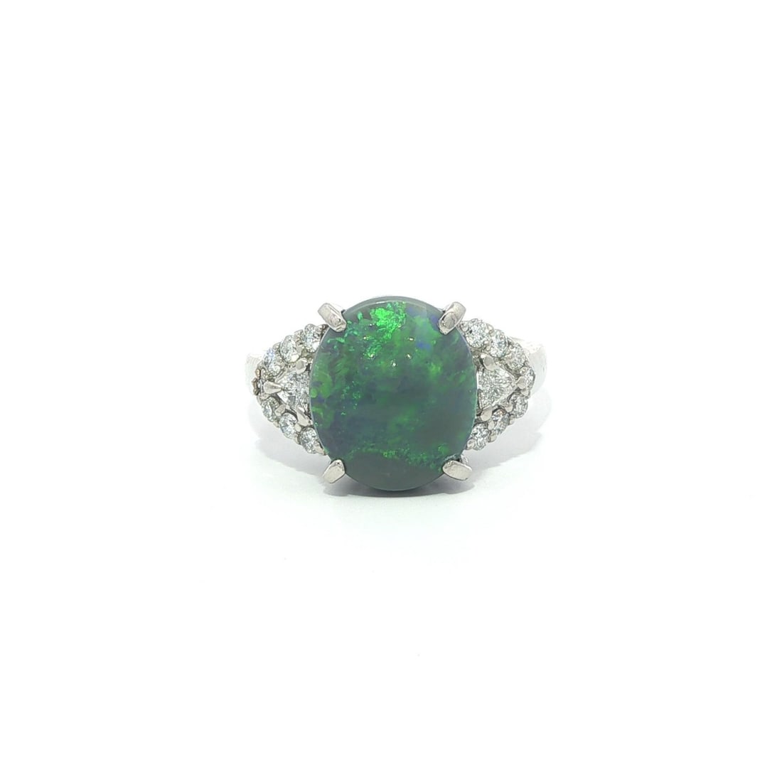 Platinum Cabochon Opal and Diamond Accent Cocktail Ring in Size 6: Platinum Cabochon Opal and Diamond Accent Cocktail Ring in Size 6 This platinum cocktail ring features a natural oval cabochon cut opal as the centerpiece, displaying a striking green play of colors o