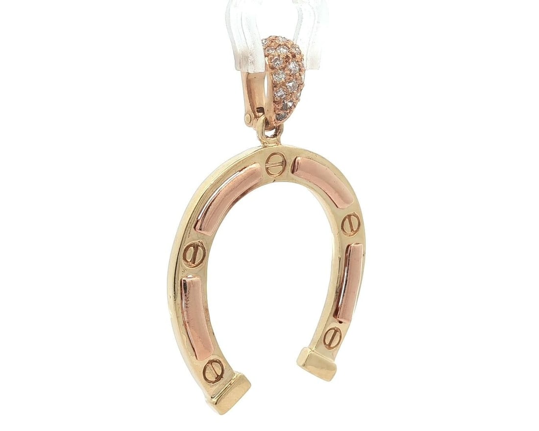 Vintage 14k Yellow Rose Gold Horseshoe Diamond Pendant 0.20ctw: Vintage 14k Yellow Rose Gold Horseshoe Diamond Pendant 0.20ctw This stunning vintage pendant features a large horseshoe design, beautifully crafted in solid 14k yellow and rose gold. It is adorned wit