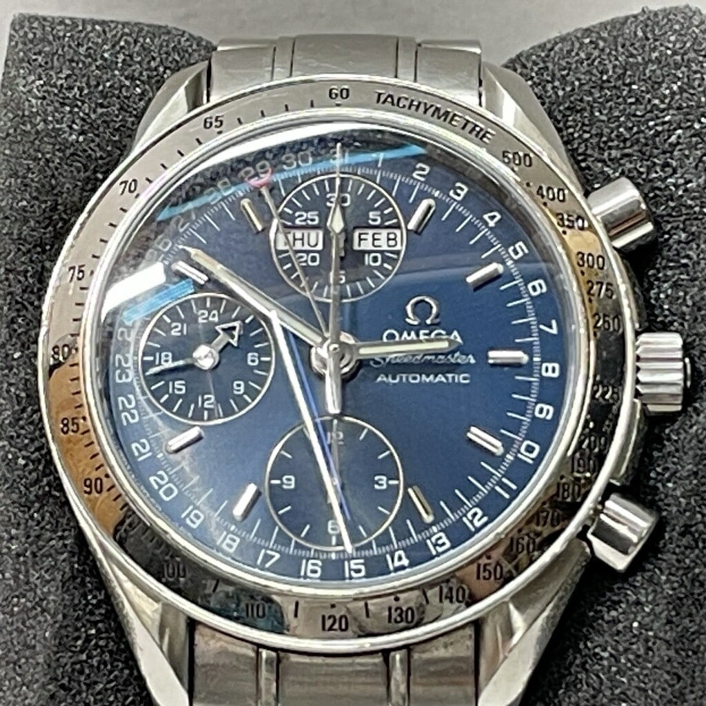 OMEGA 3523.80 Automatic Steel Chronograph Day Date Wristwatch: OMEGA 3523.80 Automatic Steel Chronograph Day Date Wristwatch This OMEGA Speedmaster Day-Date is a men's wristwatch crafted from stainless steel and features a chronograph function. The watch is power